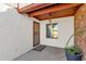 Covered entryway with security door and terracotta tile flooring at 3101 W Topeka Dr, Phoenix, AZ 85027