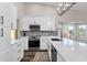 Bright kitchen featuring white cabinets, quartz countertops, and stainless steel appliances at 3101 W Topeka Dr, Phoenix, AZ 85027