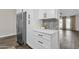 White kitchen cabinets and quartz countertops at 3101 W Topeka Dr, Phoenix, AZ 85027