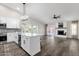 Open concept kitchen with island and stainless steel appliances at 3101 W Topeka Dr, Phoenix, AZ 85027