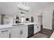 Modern kitchen with white cabinets and stainless steel appliances at 3101 W Topeka Dr, Phoenix, AZ 85027