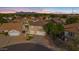 Aerial view of two story house with pool and surrounding neighborhood at 3141 S 83Rd Cir, Mesa, AZ 85212