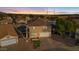 Aerial view of two story house with pool and surrounding neighborhood at 3141 S 83Rd Cir, Mesa, AZ 85212