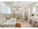 Luxurious bathroom with soaking tub and walk-in shower at 3141 S 83Rd Cir, Mesa, AZ 85212