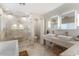 Modern bathroom with double sinks, large shower, and soaking tub at 3141 S 83Rd Cir, Mesa, AZ 85212