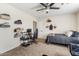 Well-lit bedroom featuring a bed, desk, and ample storage at 3141 S 83Rd Cir, Mesa, AZ 85212