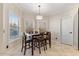 Bright breakfast nook with table and chairs, adjacent to kitchen at 3141 S 83Rd Cir, Mesa, AZ 85212