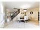 Bright dining room with a large table and chandelier at 3141 S 83Rd Cir, Mesa, AZ 85212