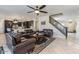 Spacious living room features leather furniture and a view into the kitchen at 3141 S 83Rd Cir, Mesa, AZ 85212