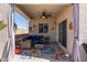 Relaxing covered patio with seating area and ceiling fan at 3189 N Excursion Ln, Casa Grande, AZ 85122