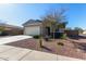 House with two-car garage and desert landscaping at 3189 N Excursion Ln, Casa Grande, AZ 85122