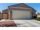 Two-car garage with neutral color exterior at 3189 N Excursion Ln, Casa Grande, AZ 85122