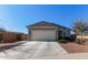 Single-story home with attached garage and landscaped front yard at 3189 N Excursion Ln, Casa Grande, AZ 85122