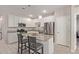 Modern kitchen with white cabinets and granite island at 3189 N Excursion Ln, Casa Grande, AZ 85122