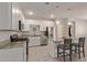 Modern kitchen with white cabinets and granite countertops at 3189 N Excursion Ln, Casa Grande, AZ 85122