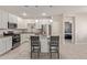 Modern kitchen with white cabinets and granite island at 3189 N Excursion Ln, Casa Grande, AZ 85122