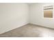 Neutral bedroom with tile floors, a window, and white walls at 3201 E Hayden Rose Ave, San Tan Valley, AZ 85143