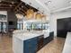 Modern kitchen with marble countertops and blue cabinets at 3201 E Hayden Rose Ave, San Tan Valley, AZ 85143