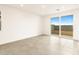 Living room featuring sliding glass doors and neutral tile flooring at 3201 E Hayden Rose Ave, San Tan Valley, AZ 85143