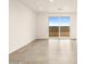 Living room featuring sliding glass doors and neutral tile flooring at 3201 E Hayden Rose Ave, San Tan Valley, AZ 85143