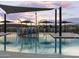 Community pool with water features and shade structures at 3201 E Hayden Rose Ave, San Tan Valley, AZ 85143