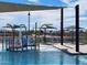 Colorful splash pad with a water curtain feature with plenty of seating and shade to sit and relax on a warm, sunny day at 3201 E Hayden Rose Ave, San Tan Valley, AZ 85143