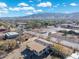 Aerial view showcasing a house and its surroundings, including nearby buildings and landscape at 3204 W Mcneil St, Laveen, AZ 85339