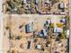 Aerial view of a property showing multiple buildings and surrounding desert landscape at 3204 W Mcneil St, Laveen, AZ 85339