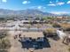 Aerial view of a house and surrounding area, showcasing the property's location and landscape at 3204 W Mcneil St, Laveen, AZ 85339