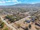 Aerial view showcasing property and mountain backdrop at 3204 W Mcneil St, Laveen, AZ 85339