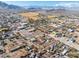 Wide aerial view of a property and surrounding neighborhood with mountain views at 3204 W Mcneil St, Laveen, AZ 85339