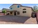 Large backyard with gravel and covered patio at 3482 W Mineral Butte Dr, San Tan Valley, AZ 85144