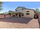 Large backyard with gravel and covered patio at 3482 W Mineral Butte Dr, San Tan Valley, AZ 85144