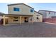 House backyard with covered patio and gravel at 3482 W Mineral Butte Dr, San Tan Valley, AZ 85144