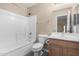 Clean bathroom with single sink, shower/tub combo and toilet at 3482 W Mineral Butte Dr, San Tan Valley, AZ 85144