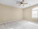 Light and airy bedroom with ceiling fan and window at 3482 W Mineral Butte Dr, San Tan Valley, AZ 85144