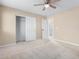 Spacious bedroom with ceiling fan and large closet at 3482 W Mineral Butte Dr, San Tan Valley, AZ 85144