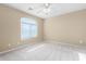 Bright bedroom featuring a large window with blinds at 3482 W Mineral Butte Dr, San Tan Valley, AZ 85144