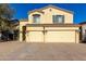 Two-story house with a three-car garage and desert landscaping at 3482 W Mineral Butte Dr, San Tan Valley, AZ 85144