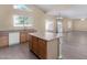 Kitchen with island, wood cabinets, and stainless steel appliances at 3482 W Mineral Butte Dr, San Tan Valley, AZ 85144