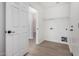 Convenient laundry room with shelving and flooring at 3482 W Mineral Butte Dr, San Tan Valley, AZ 85144