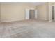 Spacious main bedroom with carpeted floor and access to other rooms at 3482 W Mineral Butte Dr, San Tan Valley, AZ 85144