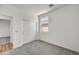 Well-lit bedroom with carpet flooring and mirrored closet doors at 37535 W Patterson St, Maricopa, AZ 85138