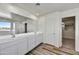 Double vanity bathroom with a shower and soaking tub at 37536 W Patterson St, Maricopa, AZ 85138