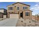 Two-story house with a large garage and neutral exterior at 37536 W Patterson St, Maricopa, AZ 85138