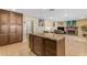 Kitchen island with granite countertop and ample storage at 408 W Straford Dr, Chandler, AZ 85225