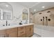 Spa-like bathroom with double vanity, large shower, and modern fixtures at 4129 E Eugie Ave, Phoenix, AZ 85032