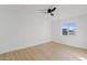 Spacious bedroom featuring light wood floors and a ceiling fan at 4129 E Eugie Ave, Phoenix, AZ 85032