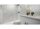 Modern bathroom with white tile and quartz vanity at 4411 N 40Th St # 52, Phoenix, AZ 85018