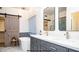 Elegant bathroom with double vanity, soaking tub and barn door at 4417 E Rancho Caliente Dr, Cave Creek, AZ 85331